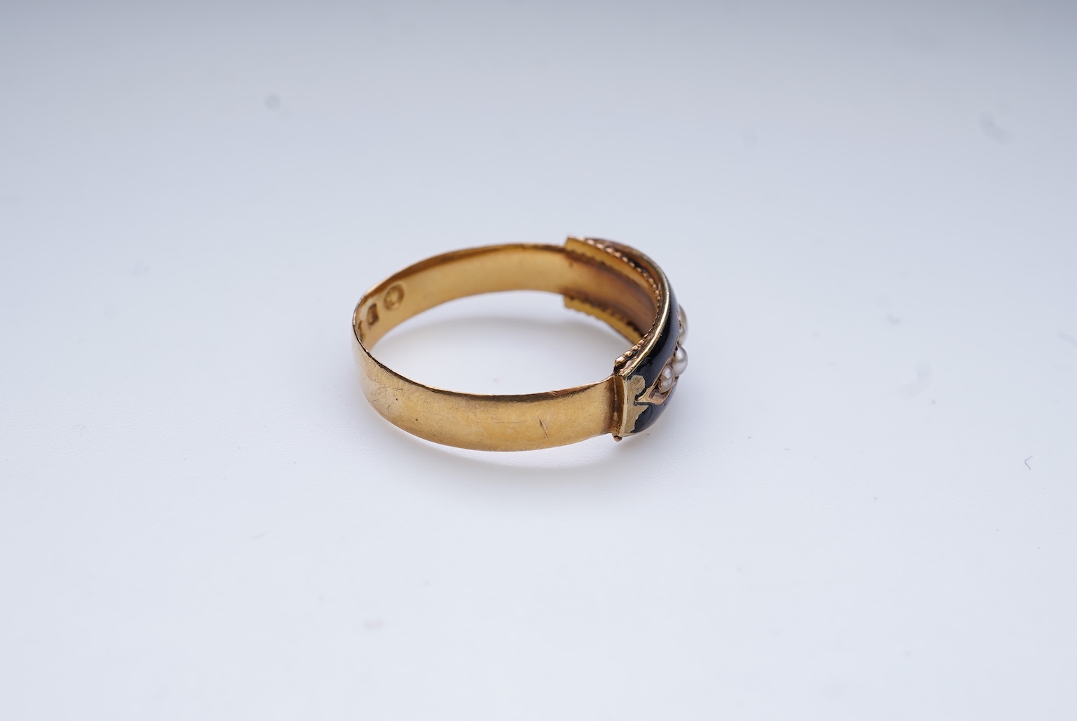 A Victorian black enamel and pearl mourning ring, 19th century